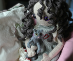 pixie's favorite knitted heidi doll dress and cat from knit and purl pets by claire garland